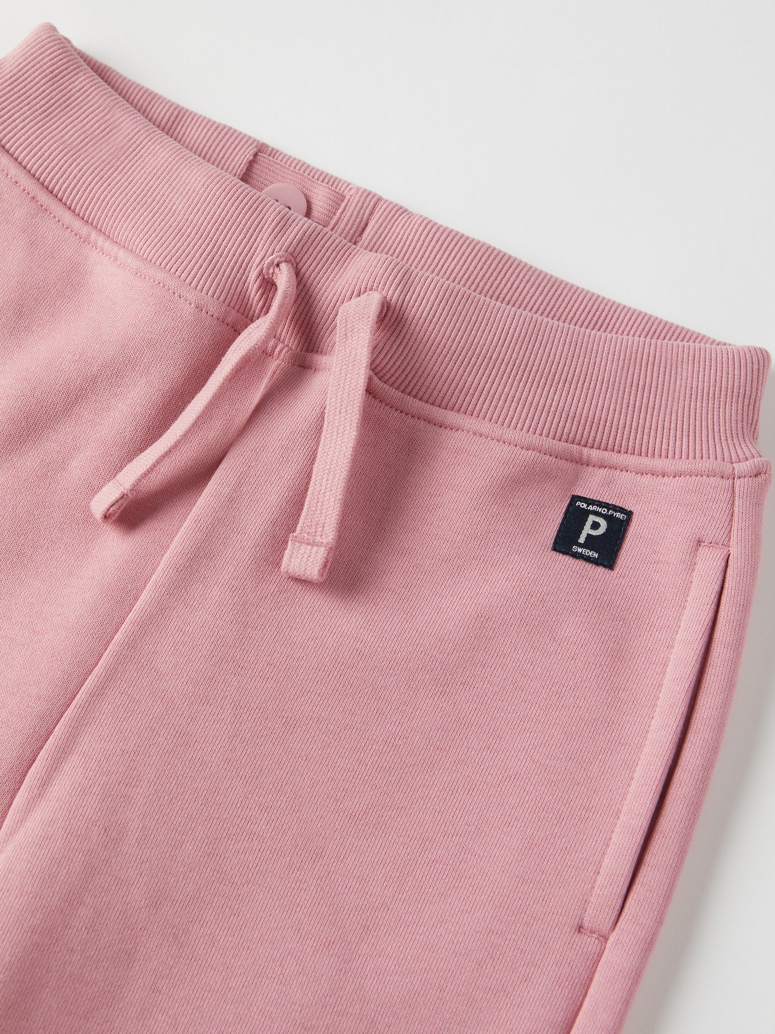 Pink Kids Joggers from Polarn O. Pyret kidswear. Clothes made using sustainably sourced materials.