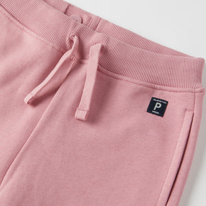 Pink Kids Joggers from Polarn O. Pyret kidswear. Clothes made using sustainably sourced materials.