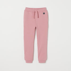 Pink Kids Joggers from Polarn O. Pyret kidswear. Clothes made using sustainably sourced materials.