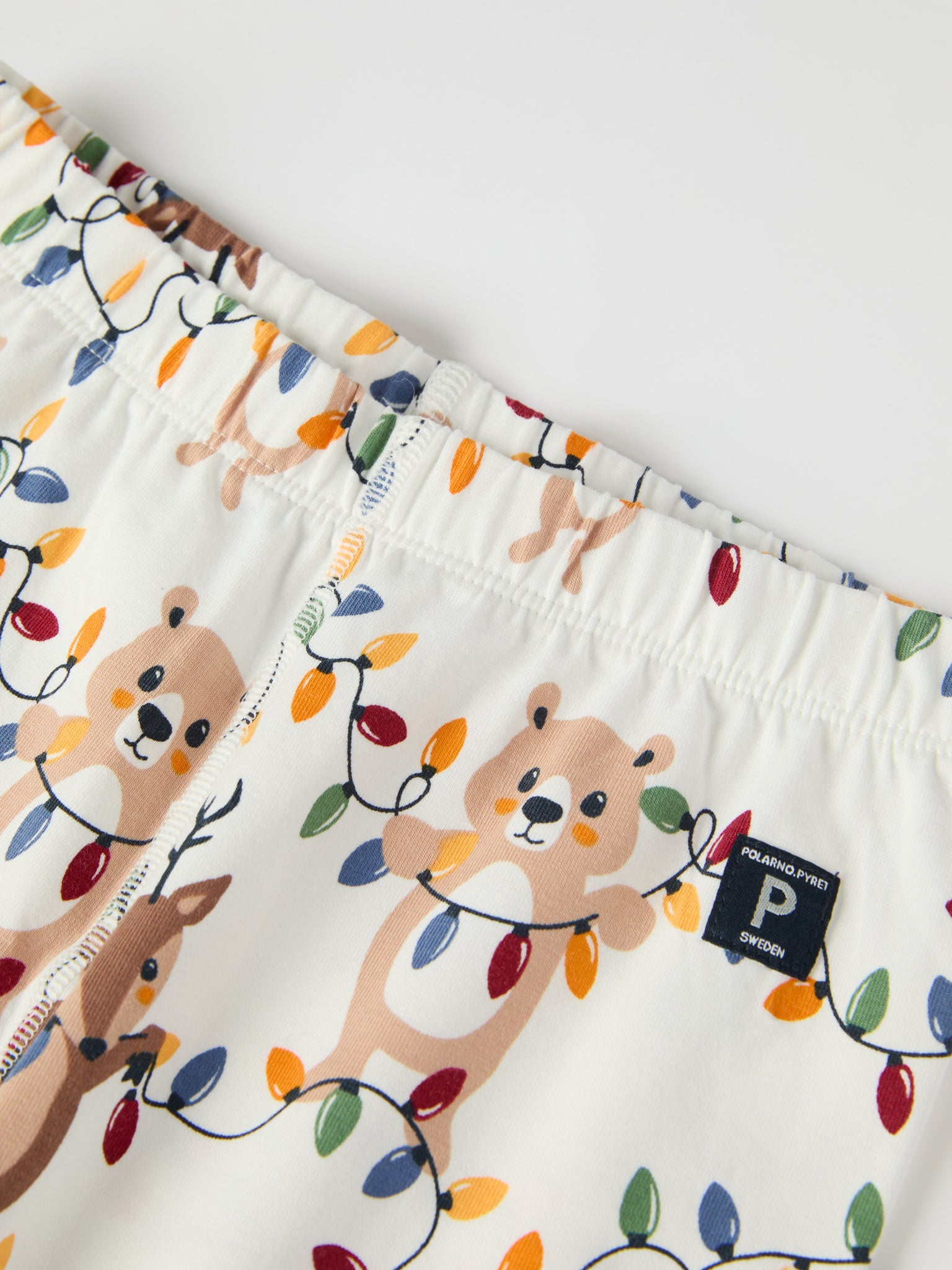 Christmas Lights Kids Pyjamas from the Polarn O. Pyret kidswear collection. Ethically produced kids clothing.