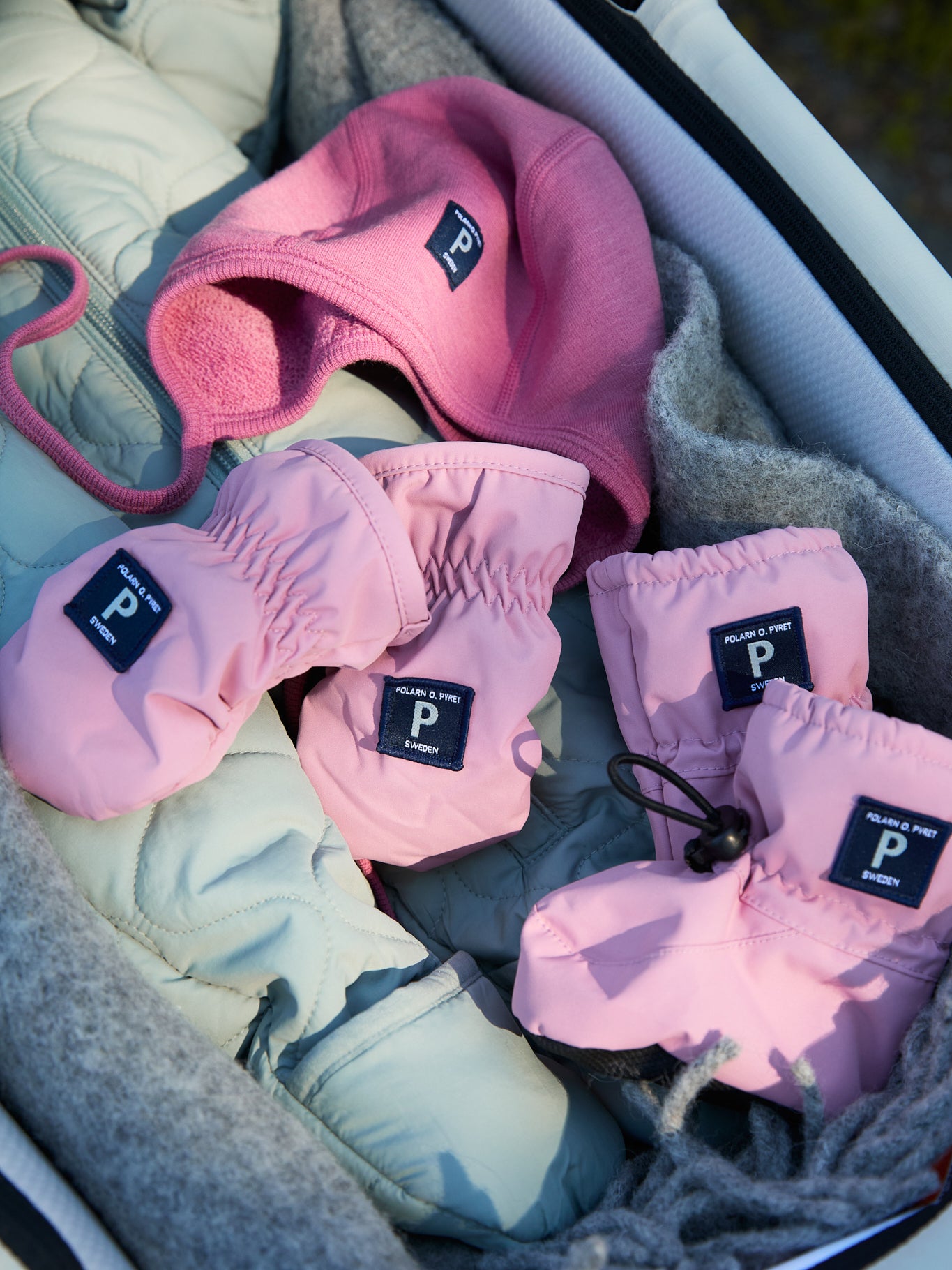 Pink Shell Fleece Lined Baby Mittens from the Polarn O. Pyret kidswear collection. Quality kids clothing made to last.