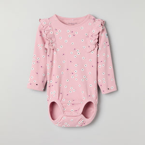 Floral Frilled Babygrow from the Polarn O. Pyret baby collection. Clothes made using sustainably sourced materials.