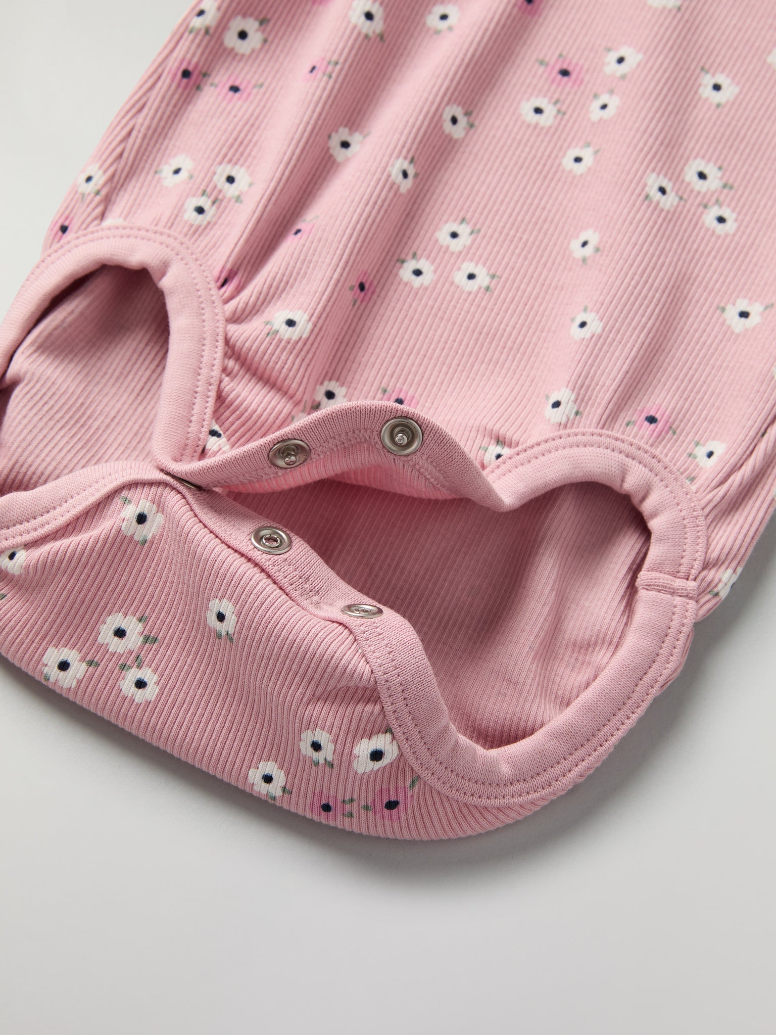 Floral Frilled Babygrow from the Polarn O. Pyret baby collection. Clothes made using sustainably sourced materials.