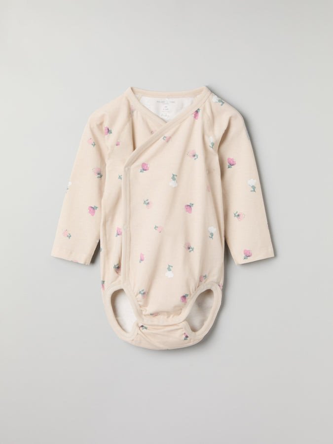 Floral Print Wraparound Babygrow from the Polarn O. Pyret baby collection. Clothes made using sustainably sourced materials.