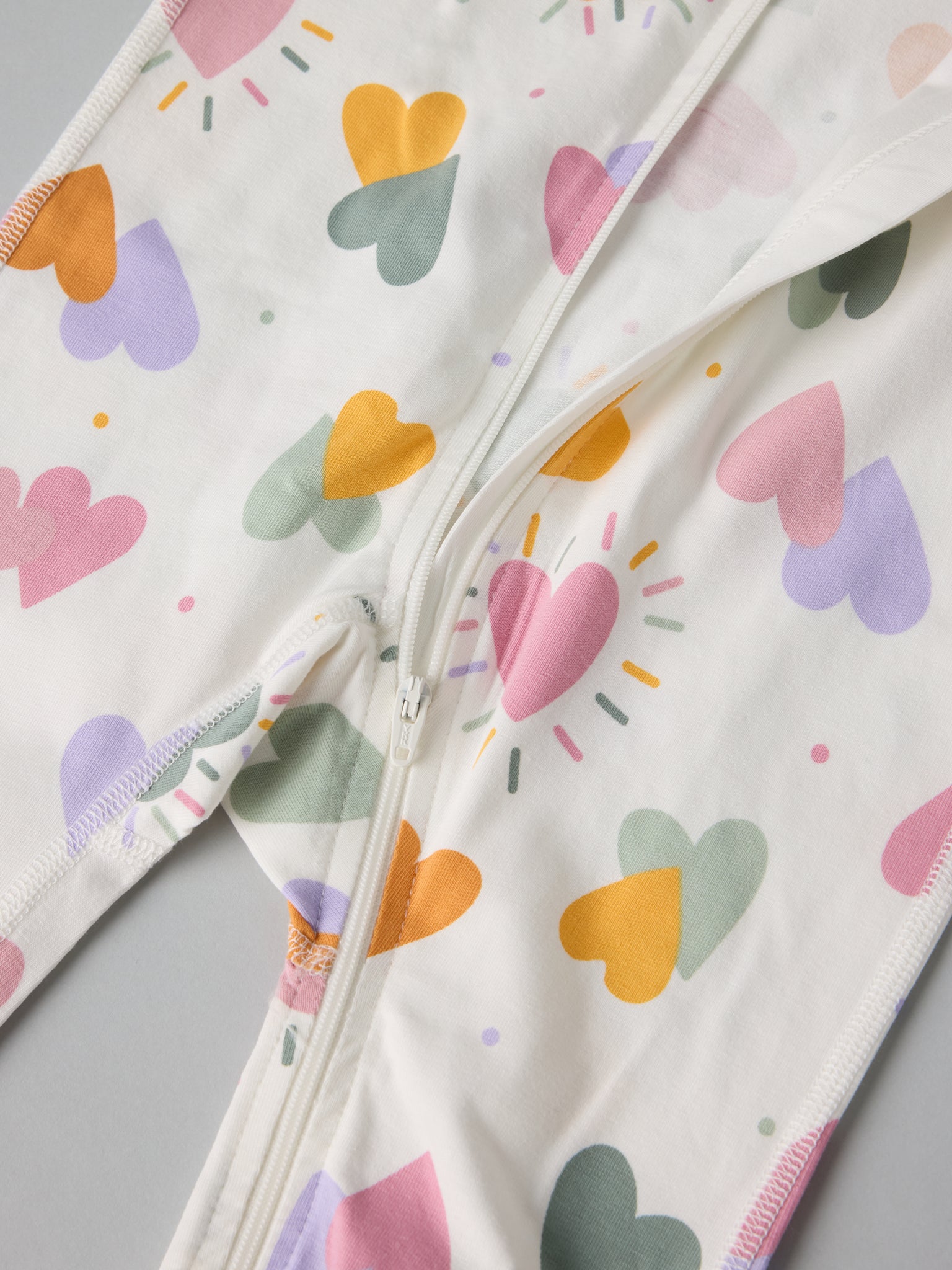 Heart Print Baby Sleepsuit from the Polarn O. Pyret baby collection. Ethically produced kids clothing.