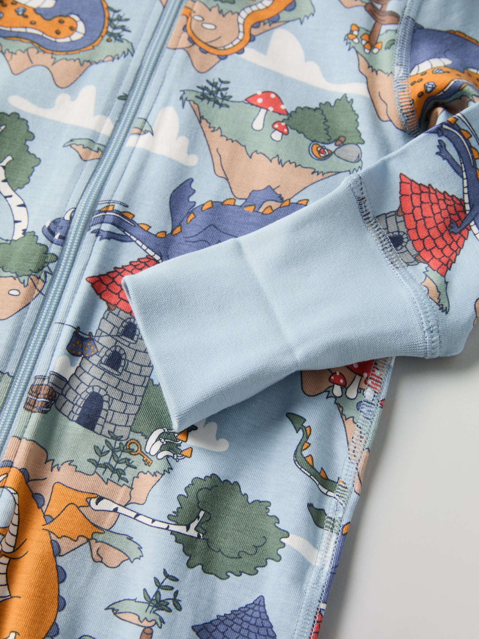 Dragon Print Baby Sleepsuit from the Polarn O. Pyret baby collection. Clothes made using sustainably sourced materials.