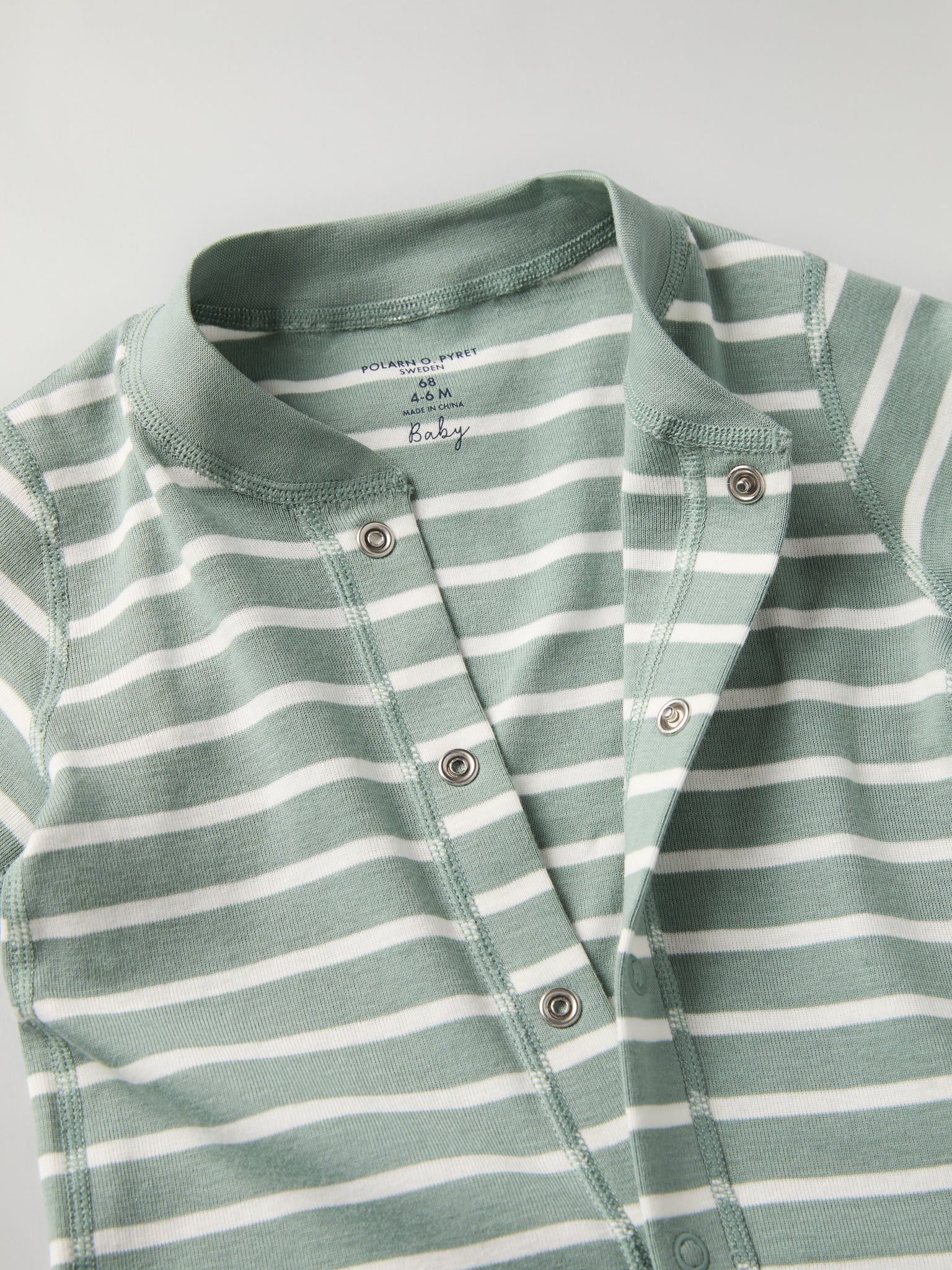 Green Striped Baby Romper from the Polarn O. Pyret baby collection. Clothes made using sustainably sourced materials.