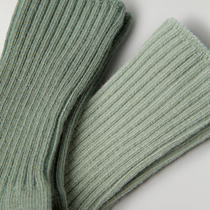 Two Pack Baby Socks in green from the Polarn O. Pyret baby collection. Clothes made using sustainably sourced materials.