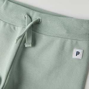 Soft Green Baby Joggers from the Polarn O. Pyret baby collection. Nordic kids clothes made from sustainable sources.