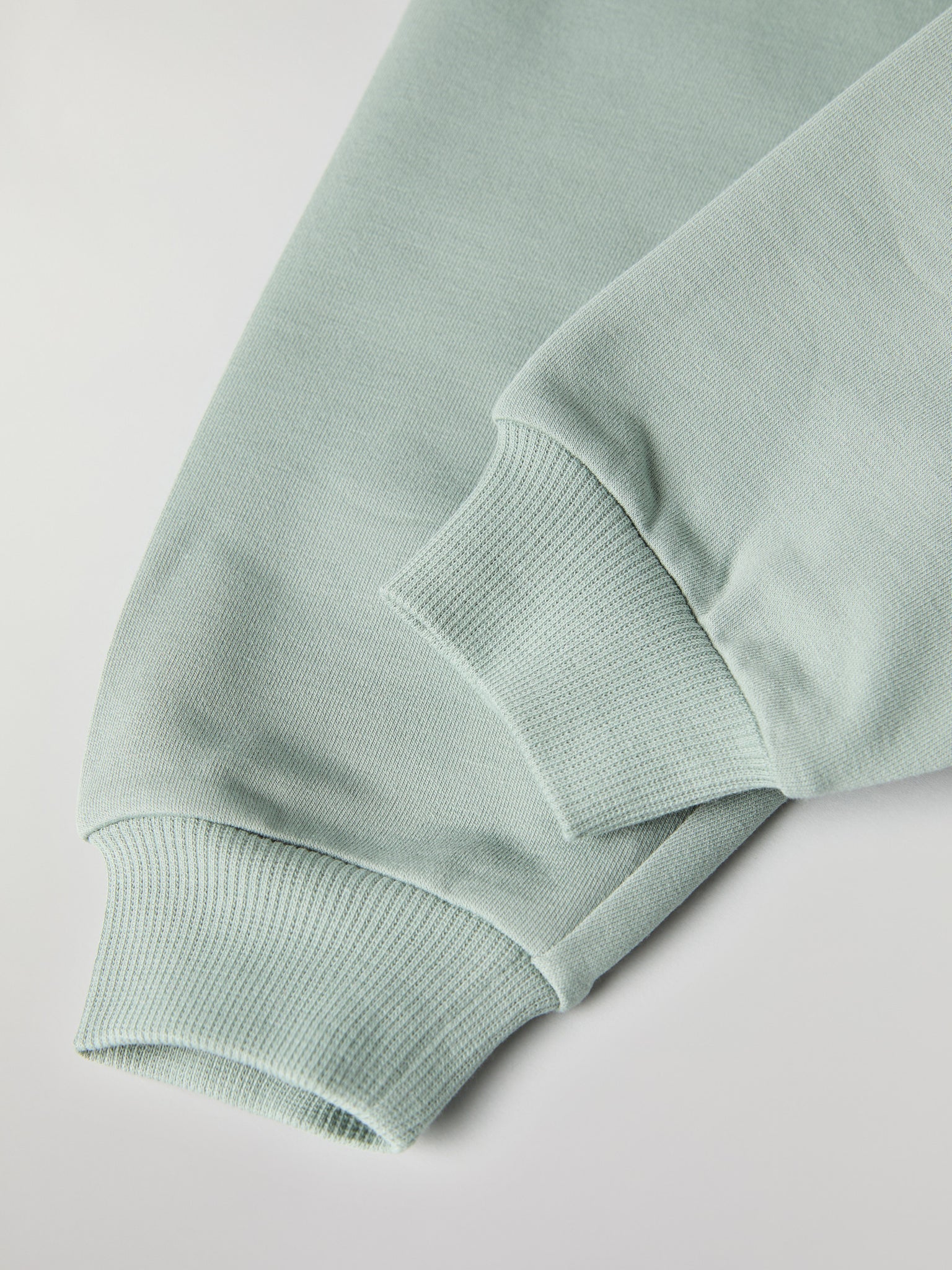 Soft Green Baby Joggers from the Polarn O. Pyret baby collection. Nordic kids clothes made from sustainable sources.