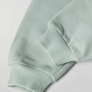 Soft Green Baby Joggers from the Polarn O. Pyret baby collection. Nordic kids clothes made from sustainable sources.