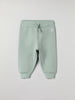 Soft Green Baby Joggers from the Polarn O. Pyret baby collection. Nordic kids clothes made from sustainable sources.