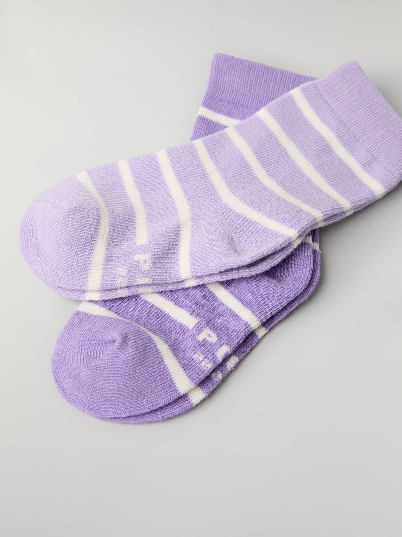 Two Pack Purple Striped Kids Socks from Polarn O. Pyret kidswear. Clothes made using sustainably sourced materials.