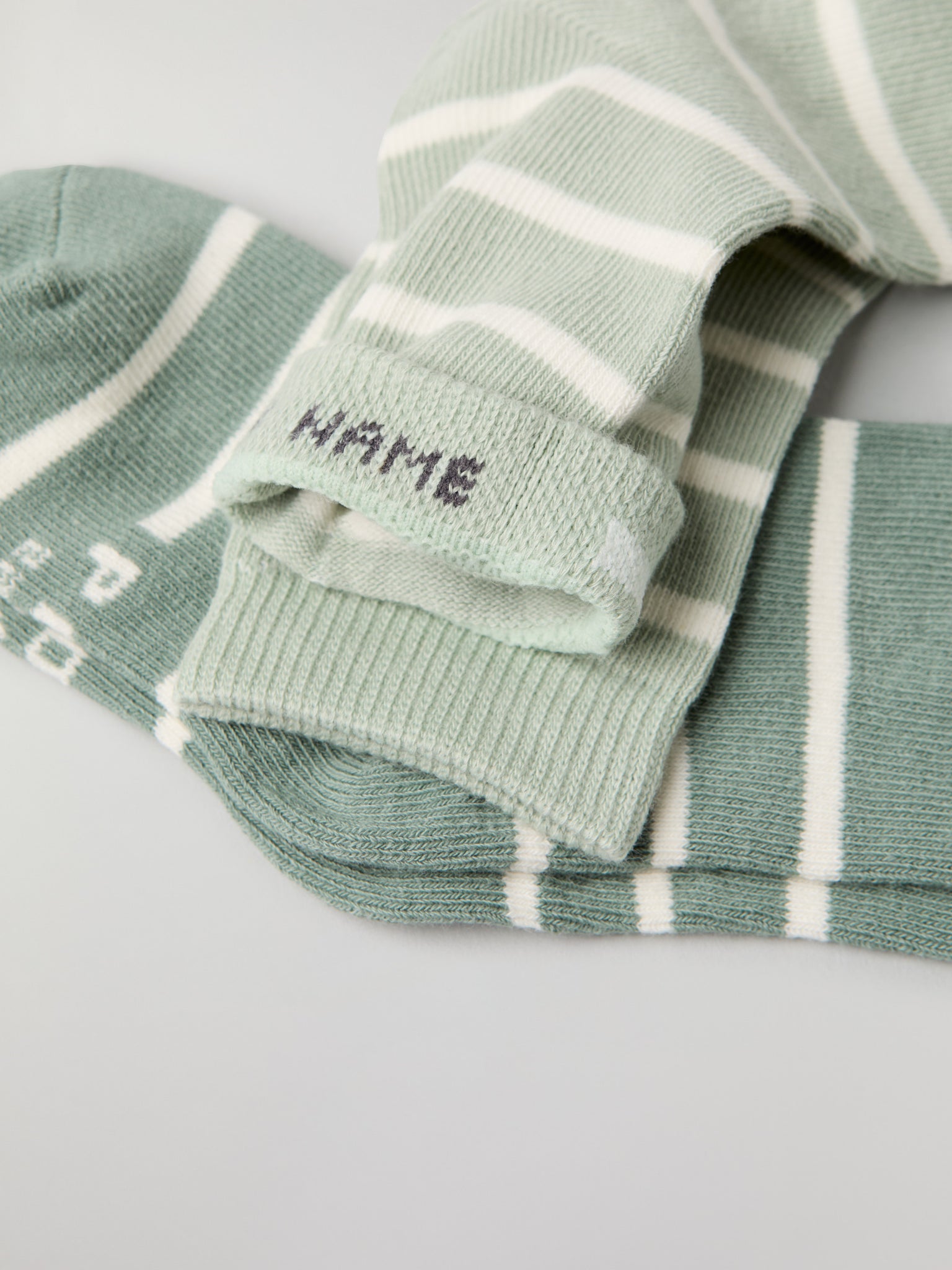 Two Pack Green Striped Kids Socks from Polarn O. Pyret kidswear. Ethically produced kids clothing.