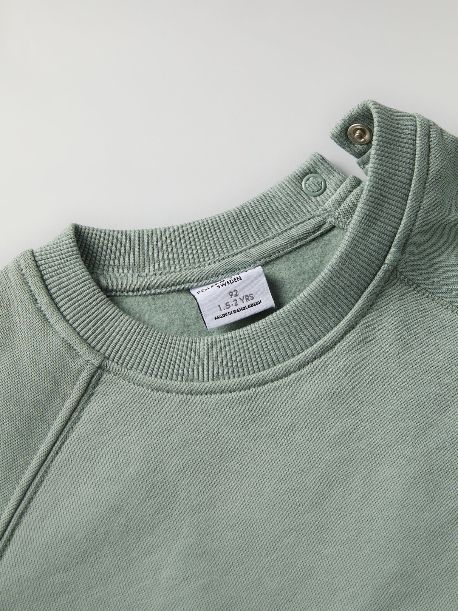 Green Kids Sweatshirt from Polarn O. Pyret kidswear. Clothes made using sustainably sourced materials.