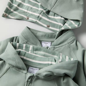 Green Baby Hoodie from the Polarn O. Pyret baby collection. Clothes made using sustainably sourced materials.