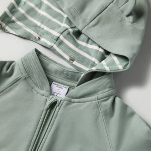 Green Baby Hoodie from the Polarn O. Pyret baby collection. Clothes made using sustainably sourced materials.