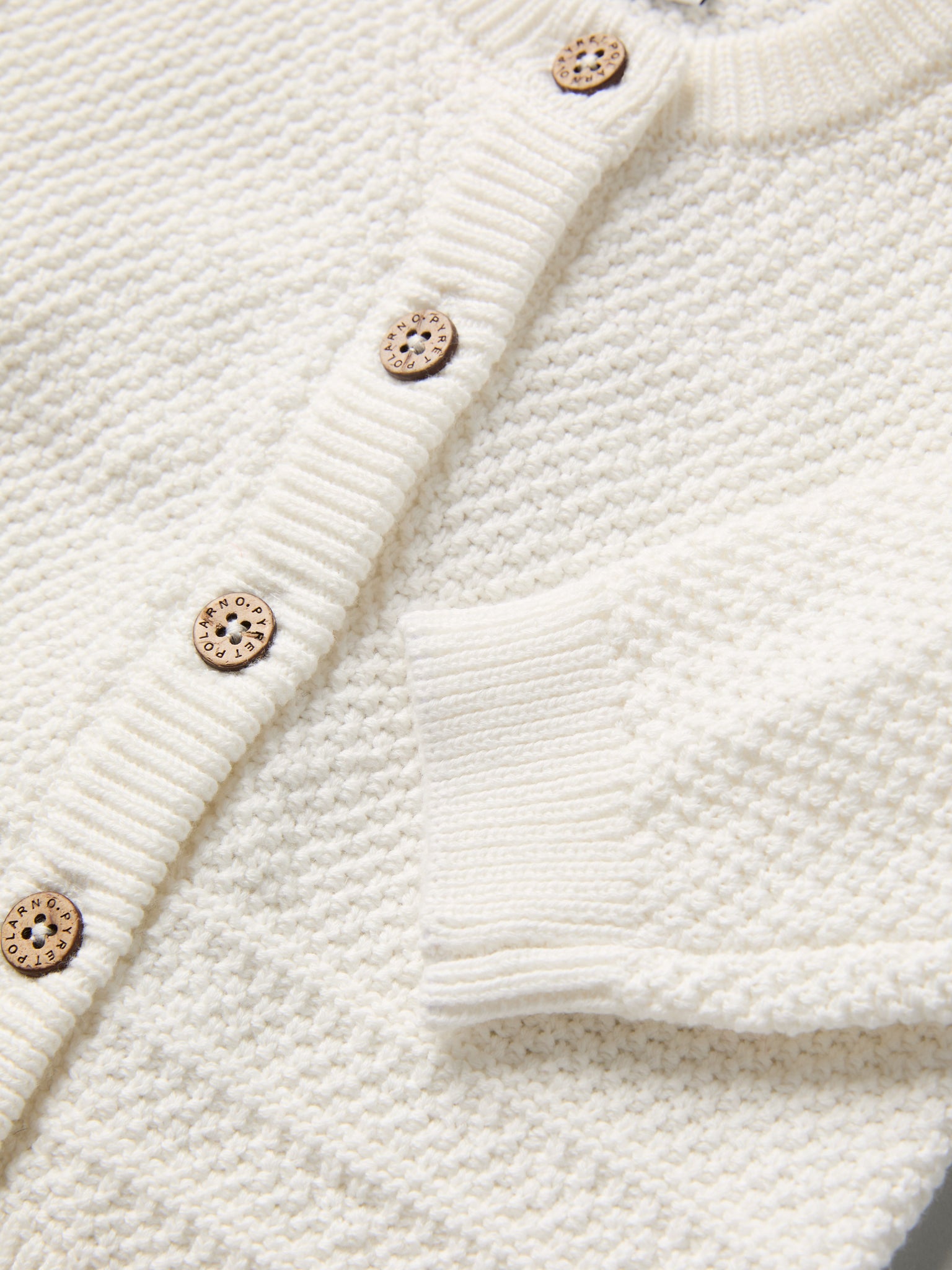 Knitted Organic Cotton Baby Cardigan from the Polarn O. Pyret baby collection. Nordic kids clothes made from sustainable sources.