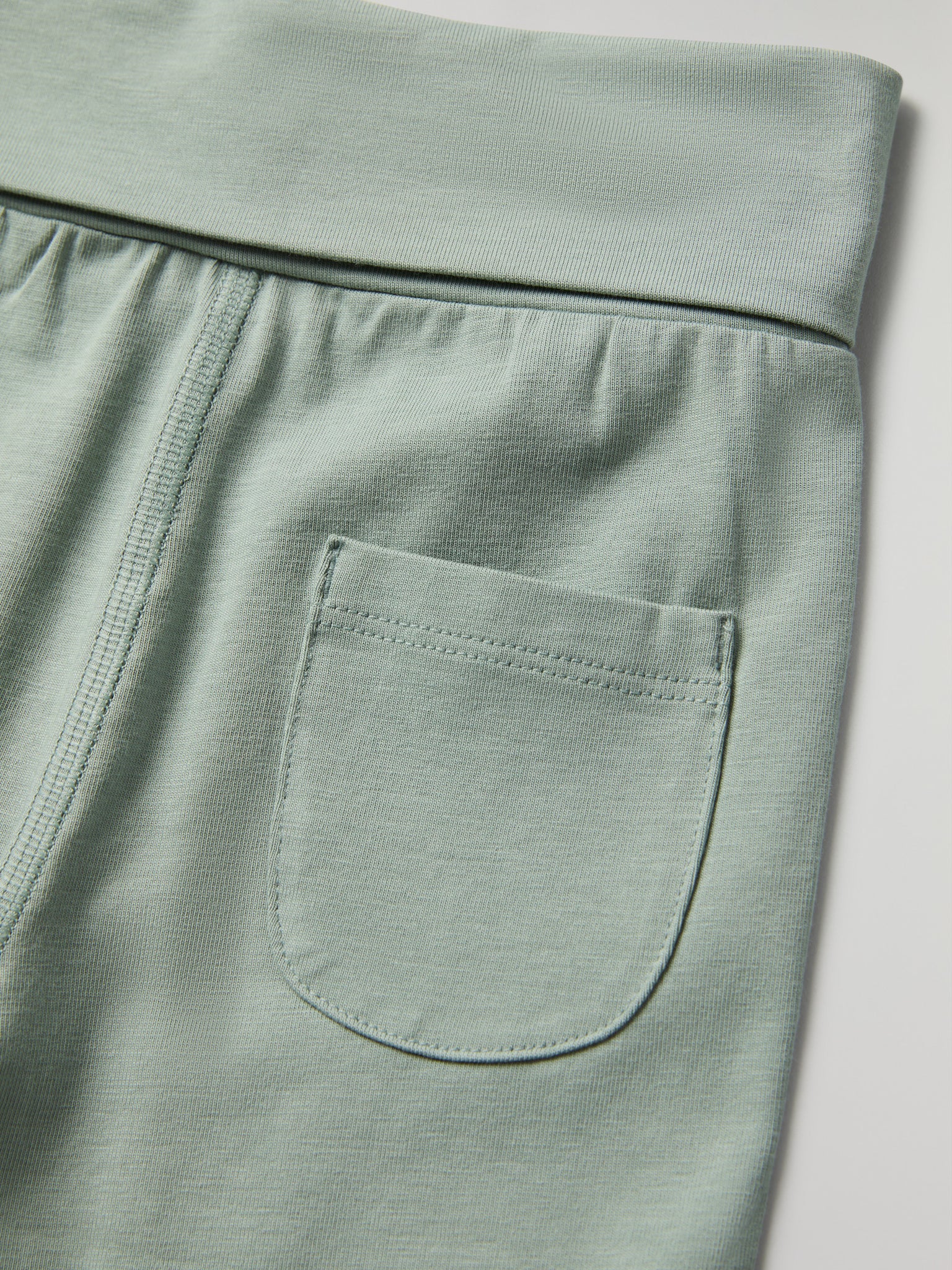 Green Soft Baby Leggings from the Polarn O. Pyret baby collection. Clothes made using sustainably sourced materials.