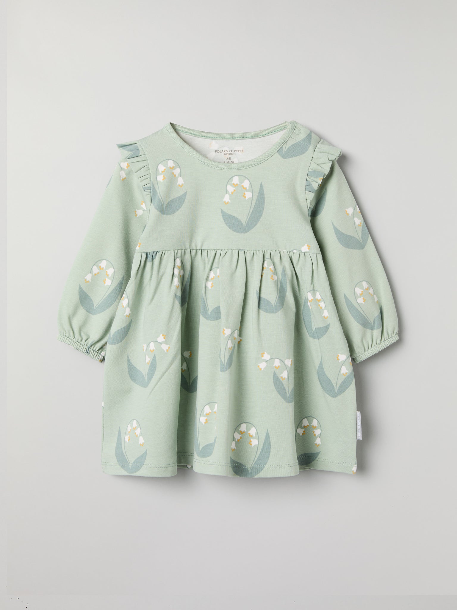 Lily Print Baby Dress from the Polarn O. Pyret baby collection. Clothes made using sustainably sourced materials.