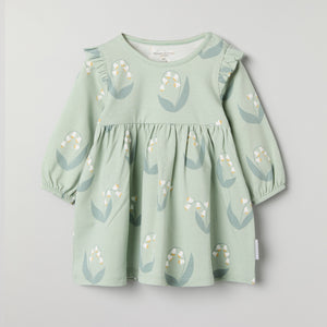 Lily Print Baby Dress from the Polarn O. Pyret baby collection. Clothes made using sustainably sourced materials.