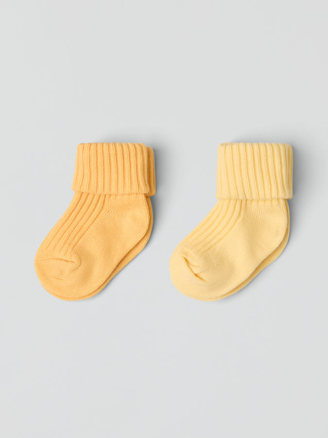 2 Pack Yellow Baby Socks from the Polarn O. Pyret baby collection. Clothes made using sustainably sourced materials.