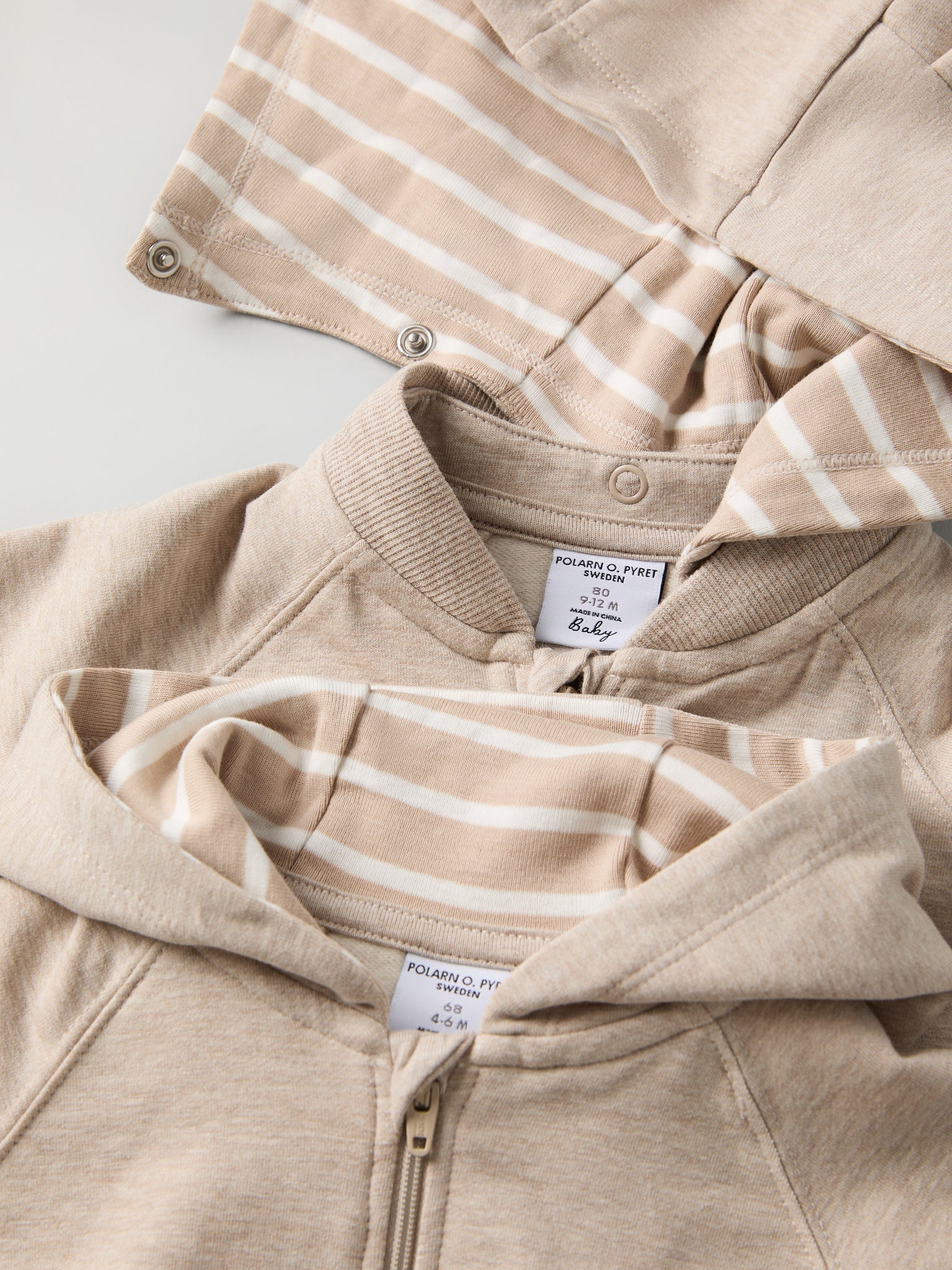 Beige Baby Hoodie from the Polarn O. Pyret baby collection. Nordic kids clothes made from sustainable sources.