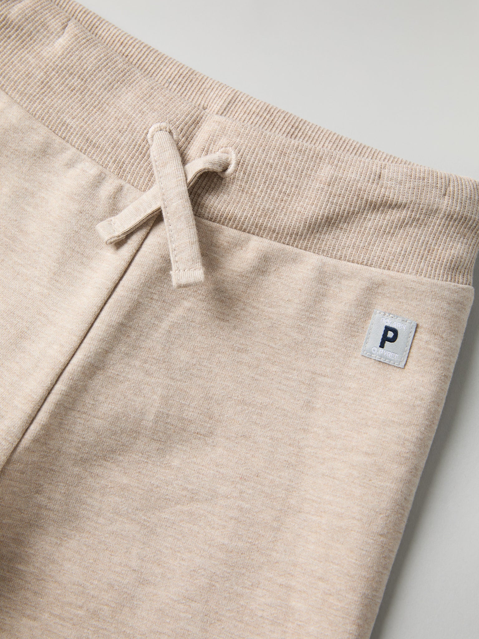 Soft Beige Baby Joggers from the Polarn O. Pyret baby collection. Ethically produced kids clothing.