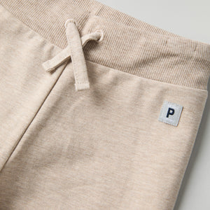 Soft Beige Baby Joggers from the Polarn O. Pyret baby collection. Ethically produced kids clothing.