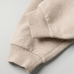 Soft Beige Baby Joggers from the Polarn O. Pyret baby collection. Ethically produced kids clothing.