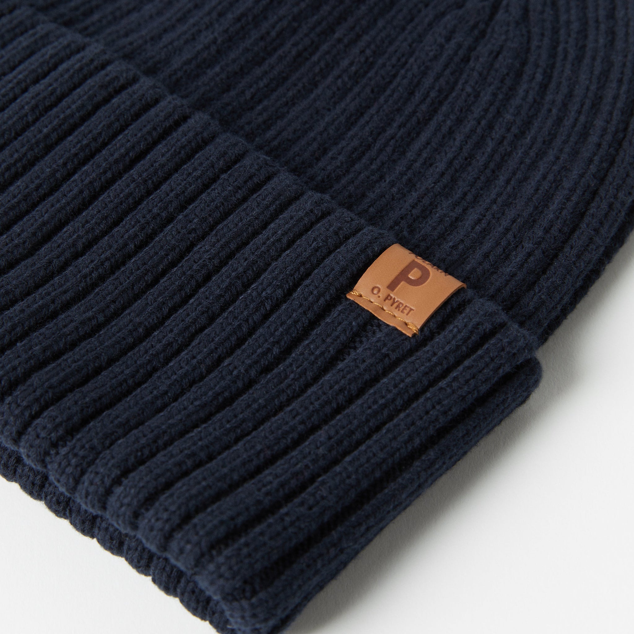 Navy Kids Knitted Hat from the Polarn O. Pyret kidswear collection. Made using ethically sourced materials.