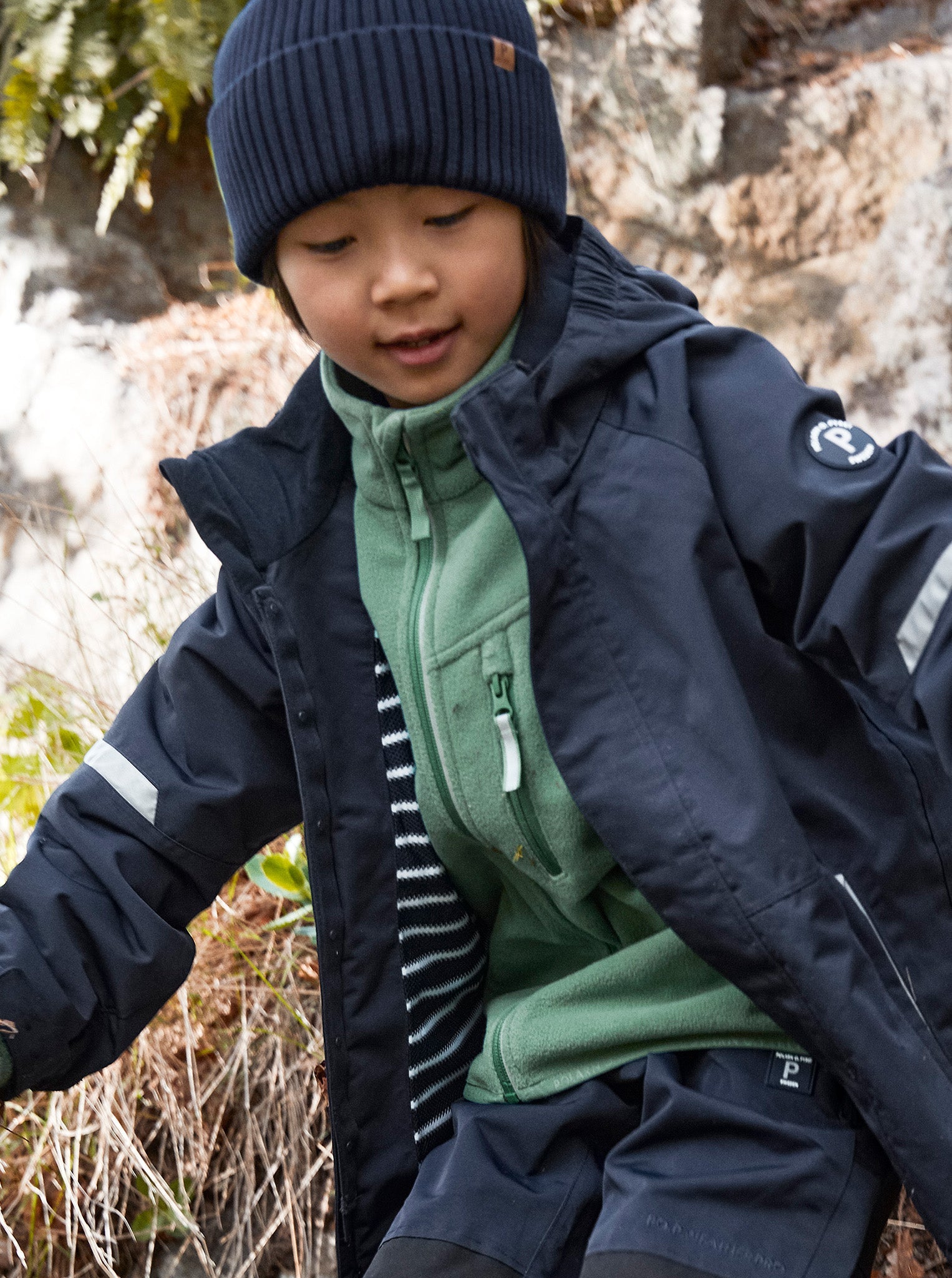 Navy Kids Knitted Hat from the Polarn O. Pyret kidswear collection. Made using ethically sourced materials.