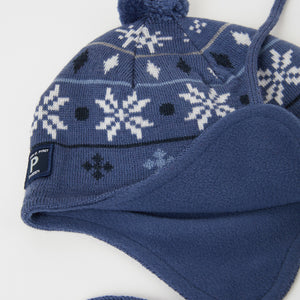 Merino Wool Blue Kids Bobble Hat from the Polarn O. Pyret outerwear collection. Kids outerwear made from sustainably source materials