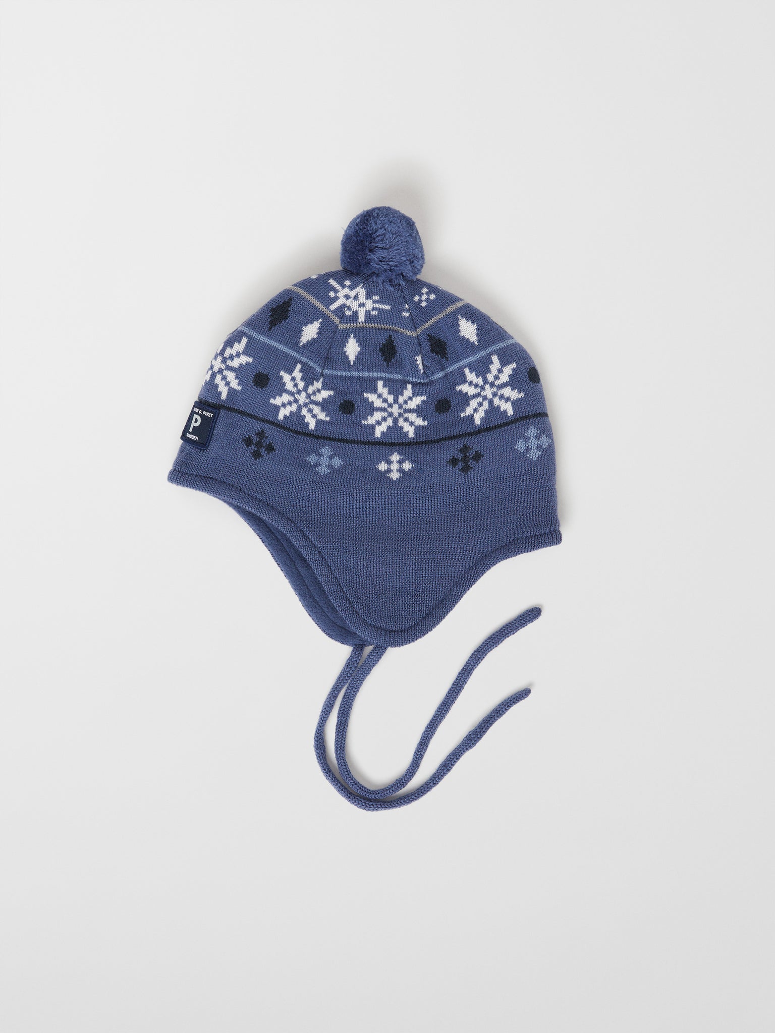 Merino Wool Blue Kids Bobble Hat from the Polarn O. Pyret outerwear collection. Kids outerwear made from sustainably source materials