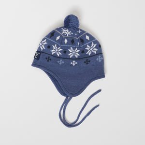 Merino Wool Blue Kids Bobble Hat from the Polarn O. Pyret outerwear collection. Kids outerwear made from sustainably source materials