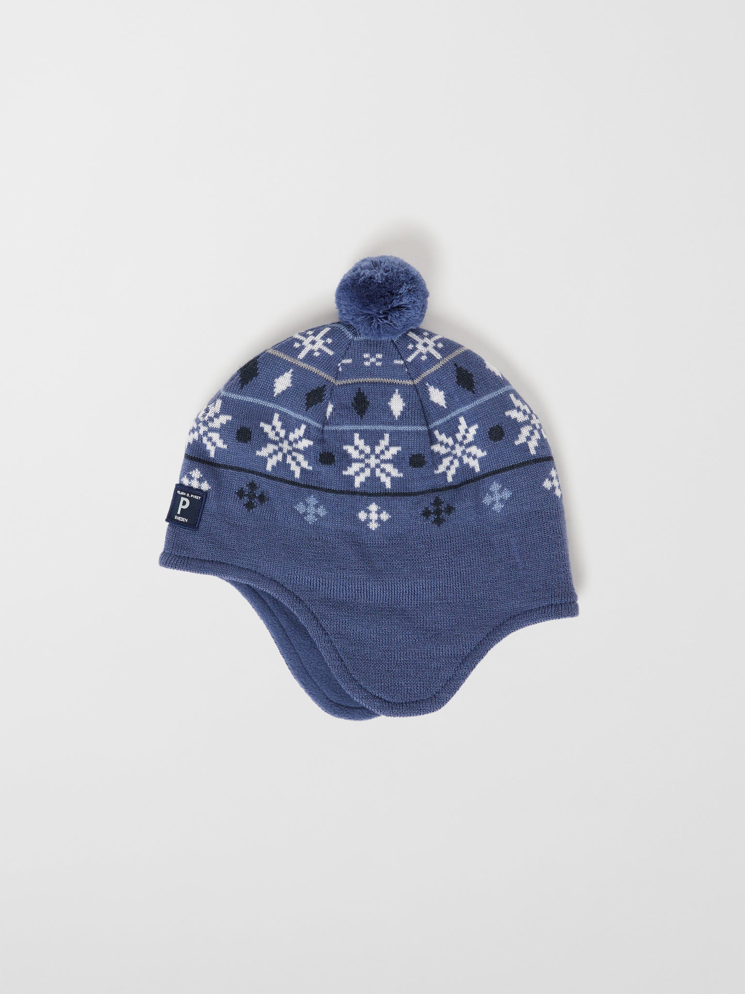 Merino Wool Blue Kids Bobble Hat from the Polarn O. Pyret outerwear collection. Kids outerwear made from sustainably source materials